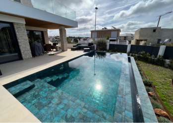 Villa with Ocean Green River flooring for pool.