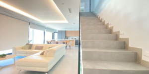 materiales-forrar-escaleras-interiores-modernas.jpg Escalera interior moderna de obra forrada con gres porcelánico gris de Gres Aragón, mostrando continuidad con el suelo del salón.